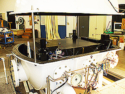 Views of the FTS show it with the vacuum chamber open for removal of the granite optics bench