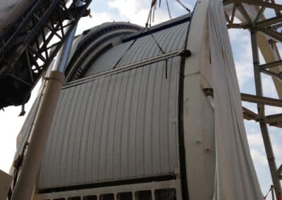 The Rear Upper Fixed Shutter Sector has been aligned between the Arch Girders and is held in place by crane while workers fasten it into place. The enclosure shutter mechanism with temporary testing cables can be seen below. 29 August 2013