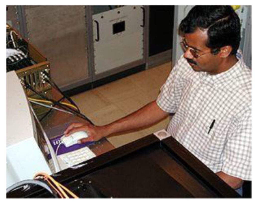 Sankarasubramanian adjusts the DLSP during a 2003 test run. The read corner of the DLSP protrudes from the bottom of the frame.