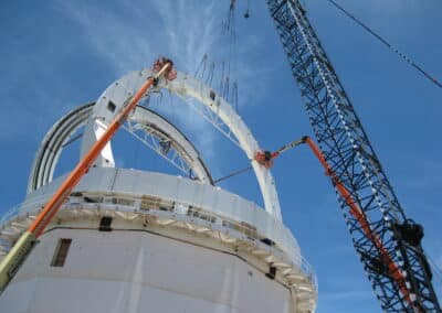 The last arch girder segment being installed on the enclosure structure. June 18, 2015.