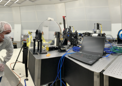 Scientist looking back up through part of the VBI optical beam path. You can see his eyeball and head imaged in the lens on the right of the photo