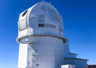 Inouye Solar Telescope with an open aperture and blue skies near Haleakalā summit, Maui, HI.